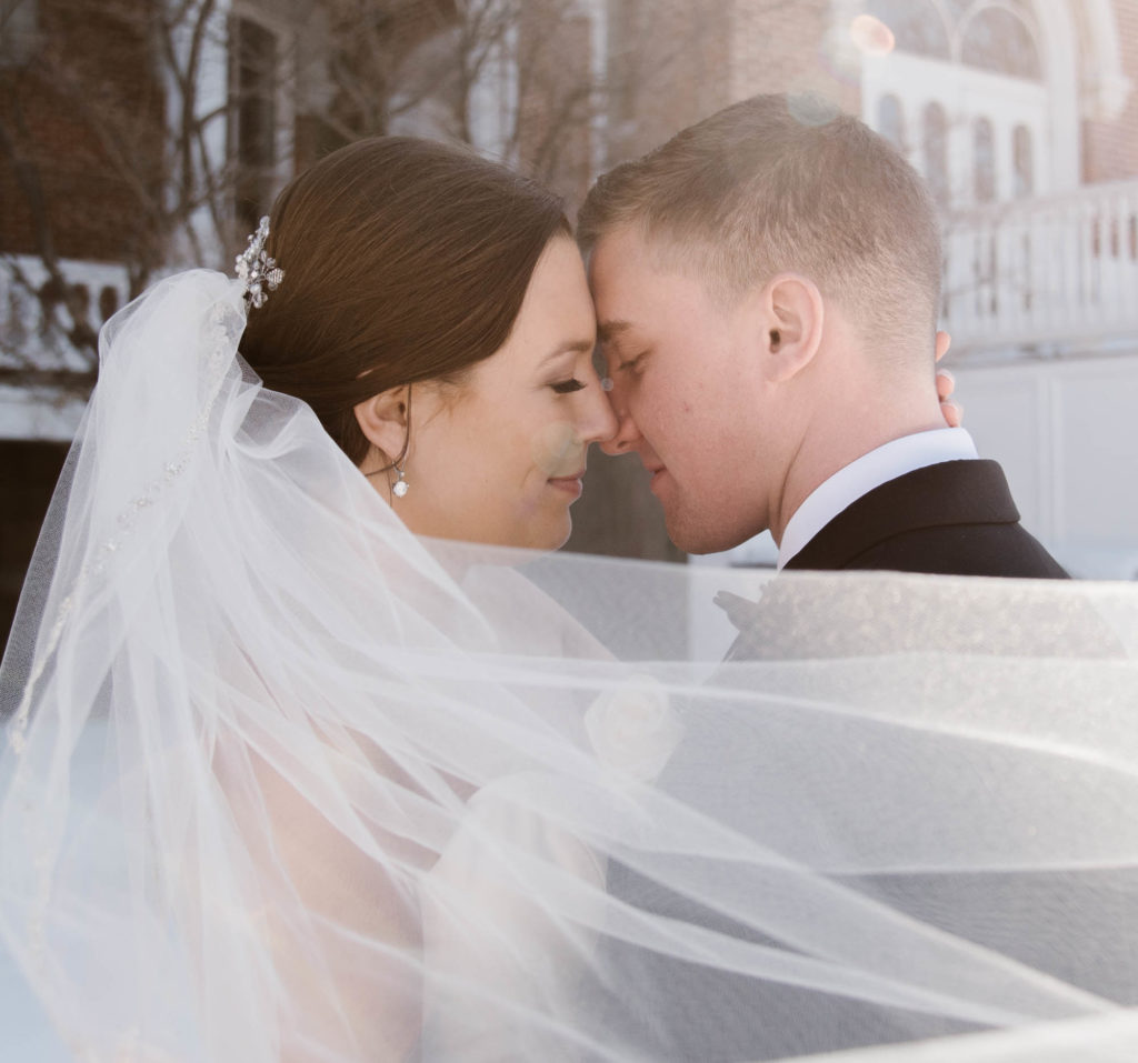 Long Veil Bride and Groom Outdoor Wedding Portrait Photo with Sun Flare