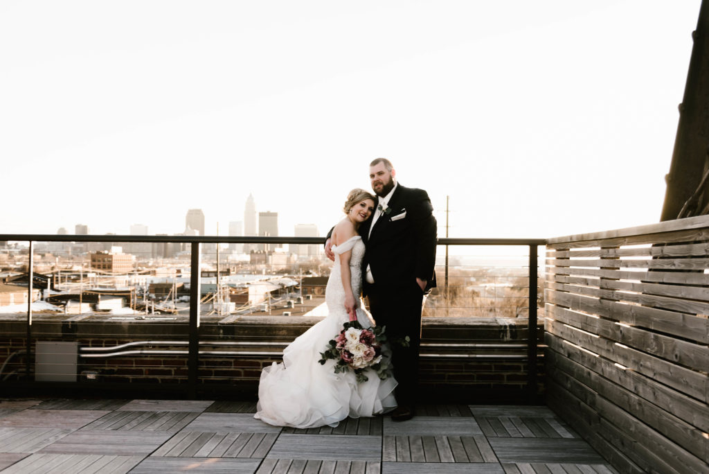 Bride and Groom at Ariel International Center with Cleveland Skyline in background