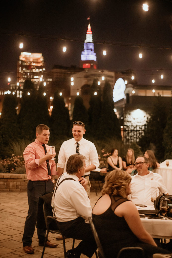 industrial wedding reception with cleveland skyline in background