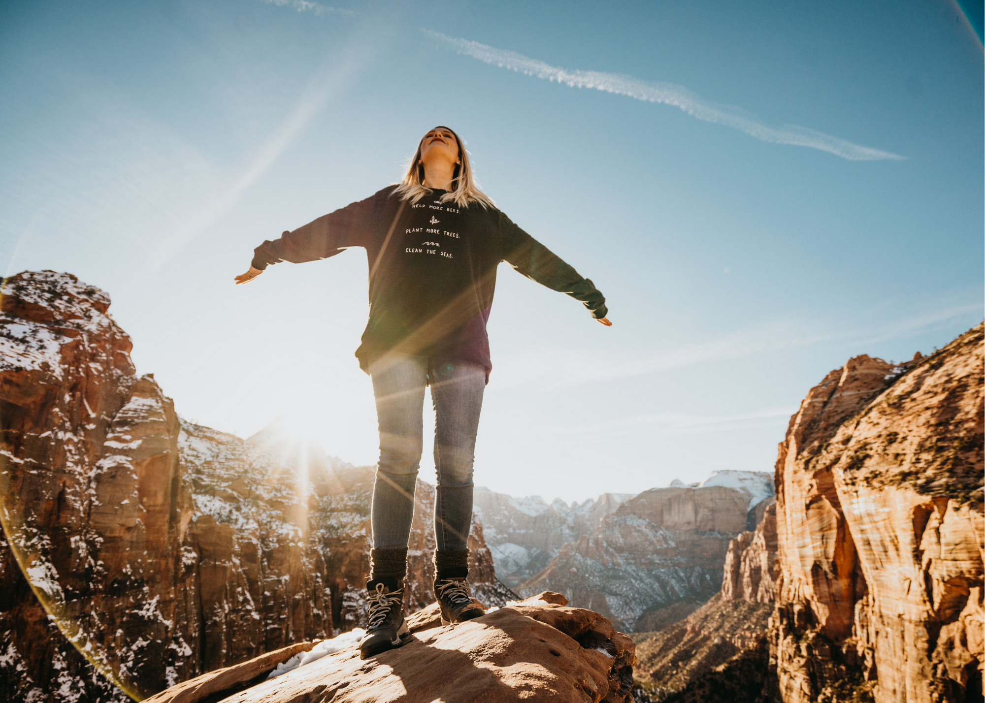 girl woman standing on mountain edge, utah