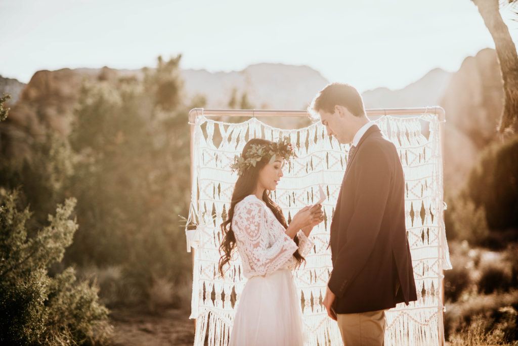 bride saying vows to groom at elopement in joshua tree national park